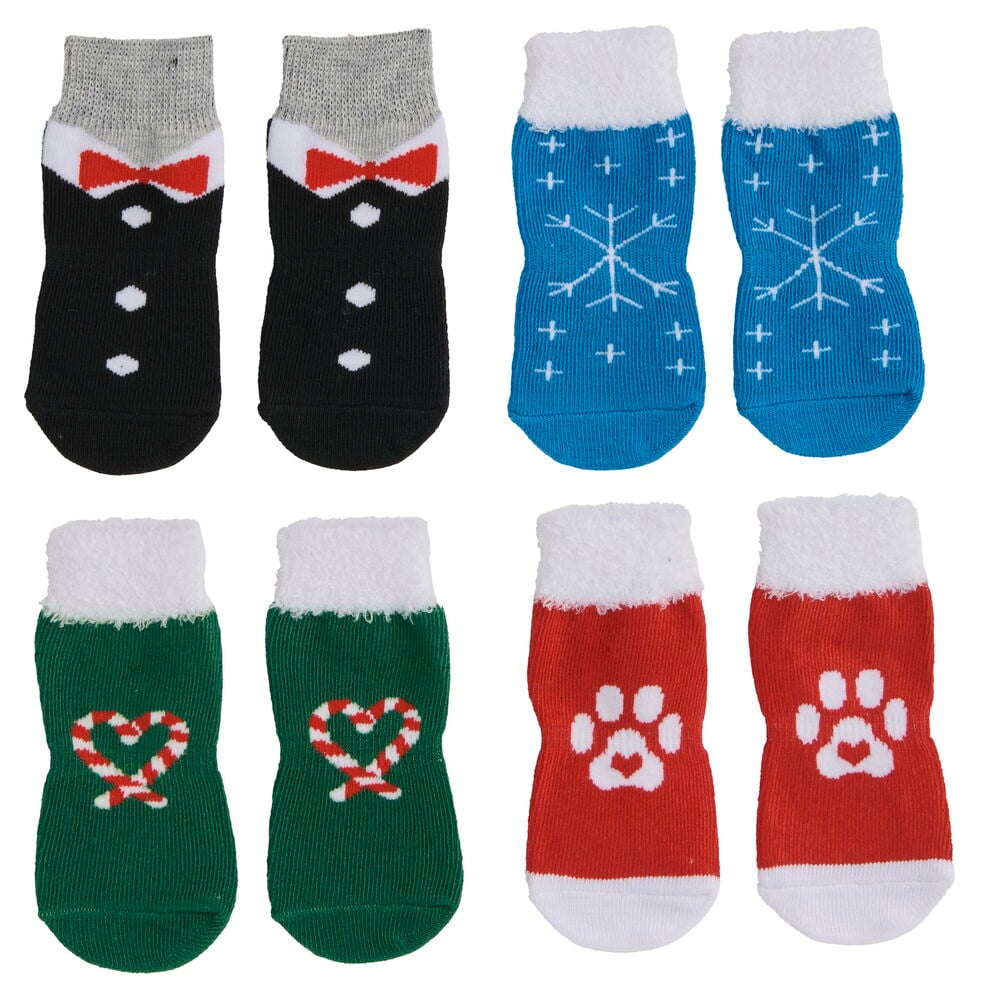Tiersocken Pet Club Verschiedene Größen Weihnachten: acht Socken mit schwarzen Smoking-, blauen Schneeflocken-, grünen Zuckerstangenherz- und roten Pfotenabdruckdesigns.
