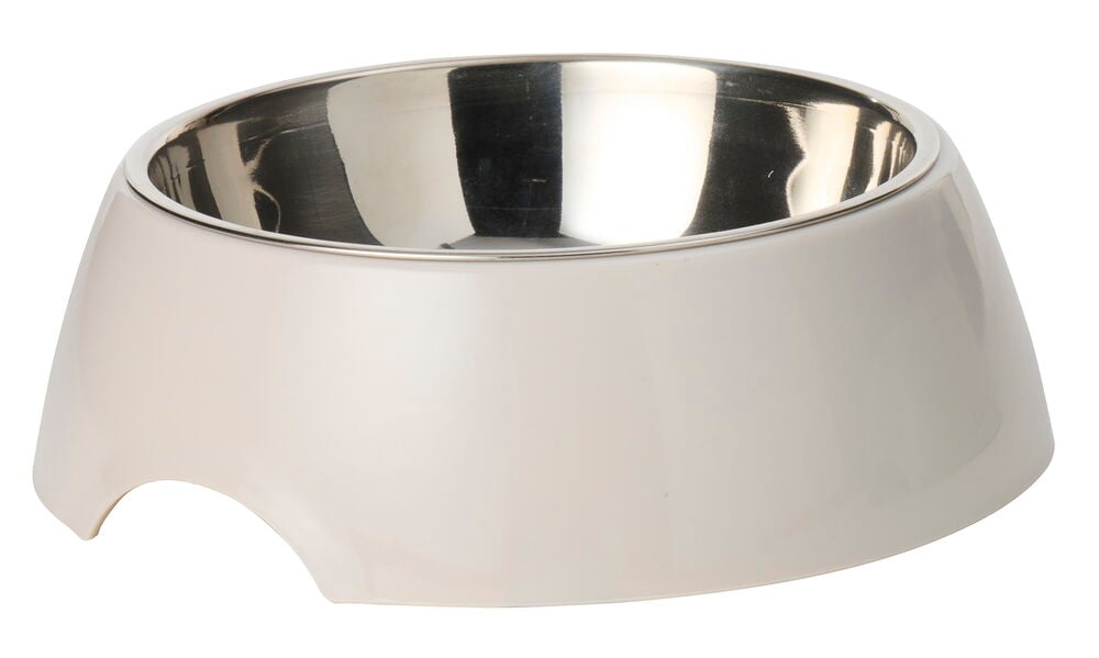 Ein beiger Futternapf 700 ml aus Kunststoff mit Edelstahleinsatz und einzigartigem Ausschnittdesign.