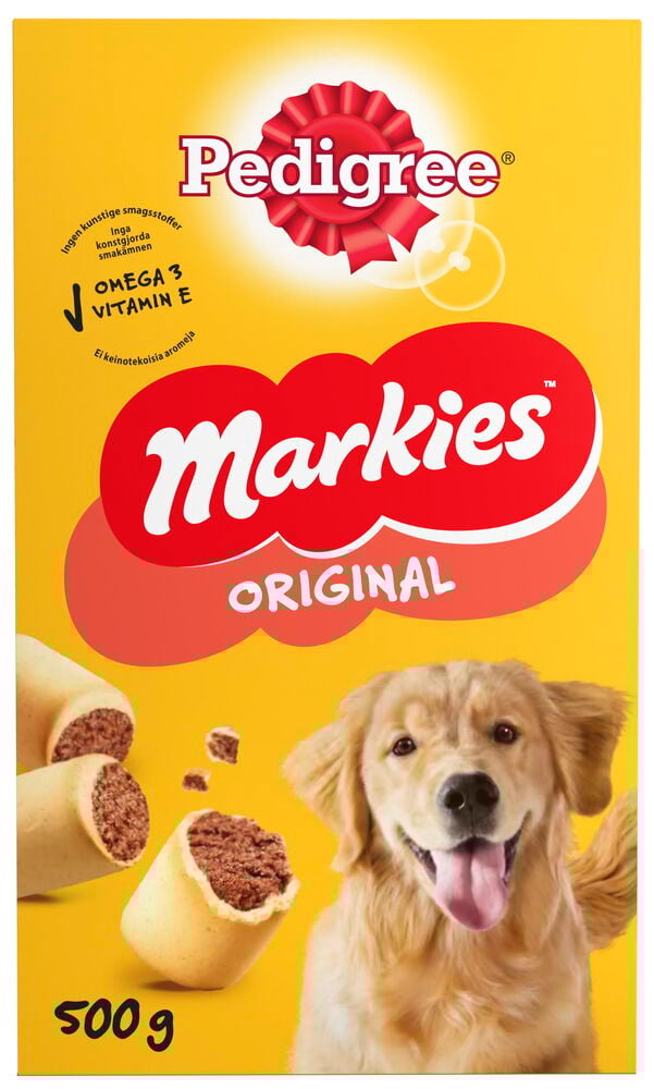 Koiran herkut Pedigree Markies 500 g, beigenväriset luunmuotoiset tummanruskealla täytteellä, näytettynä kultaisennoutajan kanssa.