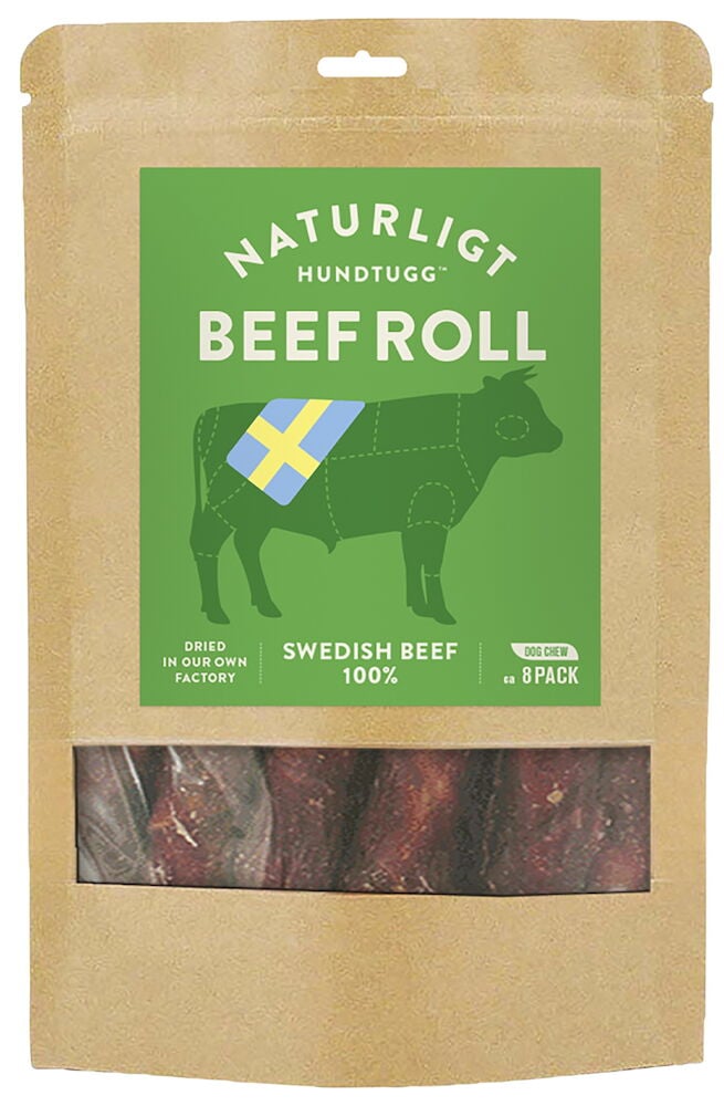 Ruskea pakkaus, jossa koiran näkyvissä olevia naudanrullia.