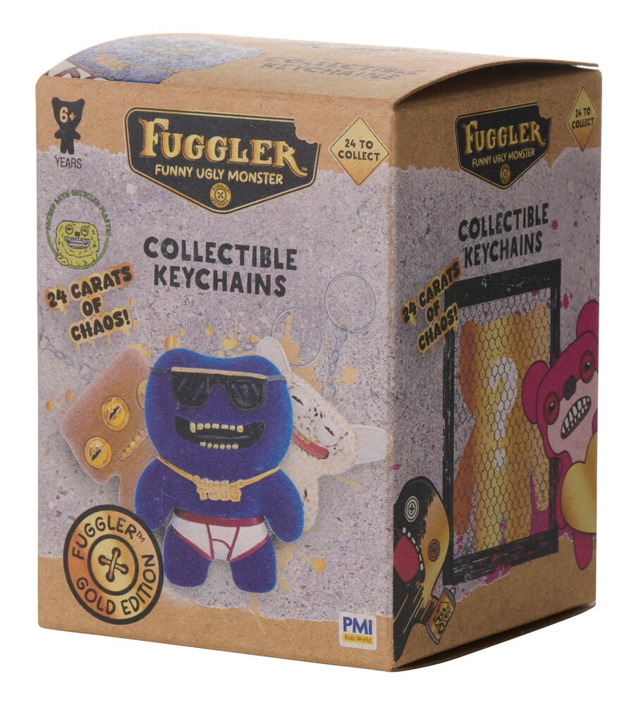 Ruskea Avainrengas Fuggler Gold Edition, erilaisia, keräilyavainrengaslaatikko esittää sinisen Fuggler-hahmon edessä.