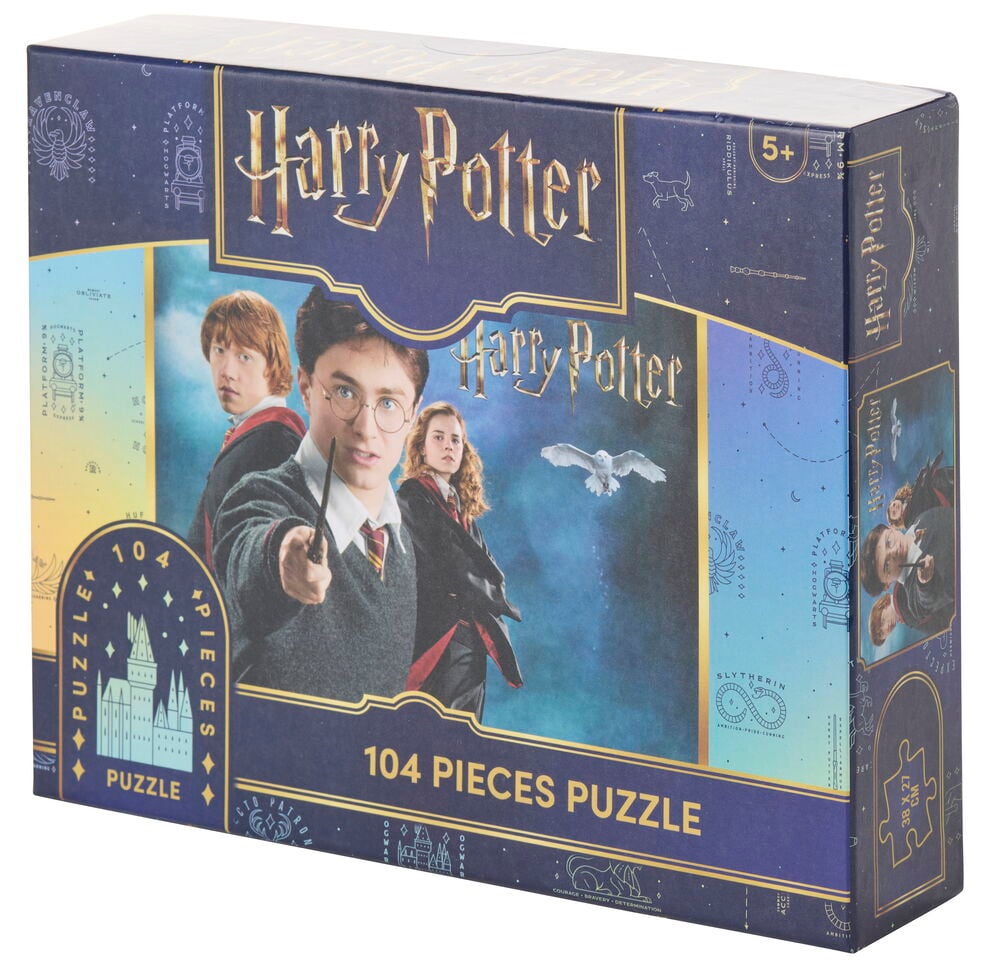 Puzzle Harry Potter 104 Teile Verschiedene Sorten in einer dunkelblauen Box mit Goldtext und Charakterbildern.