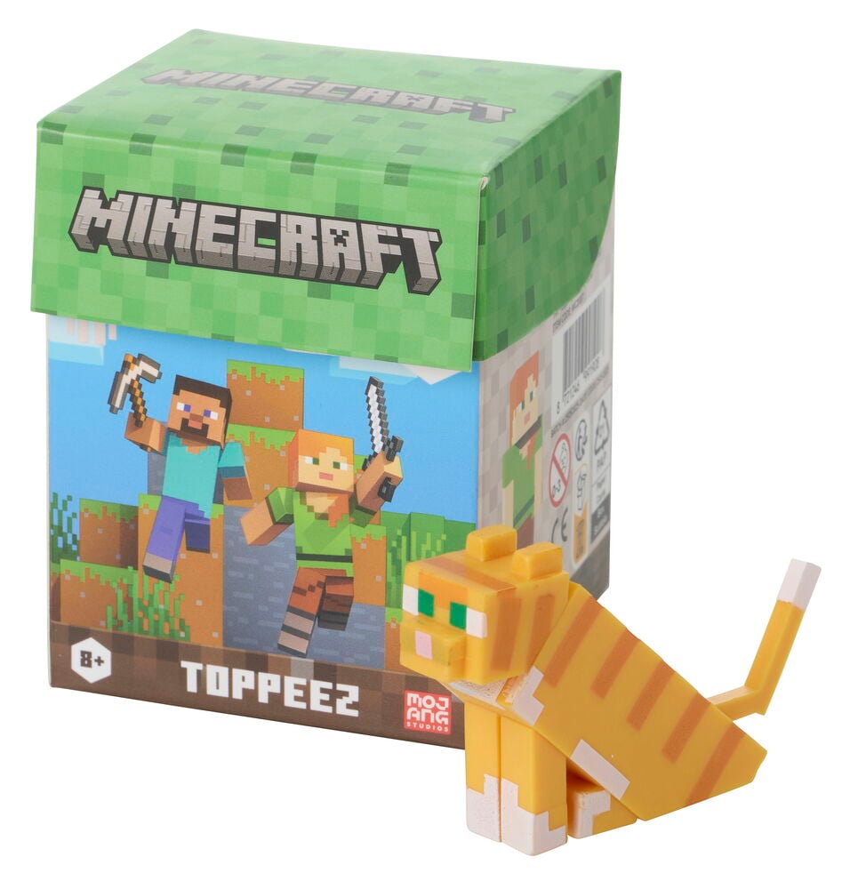 Figuuri Minecraft 5-6 cm Valikoima, oranssi ja valkoinen pikselikissahahmo vihreän Minecraft-laatikon vieressä.