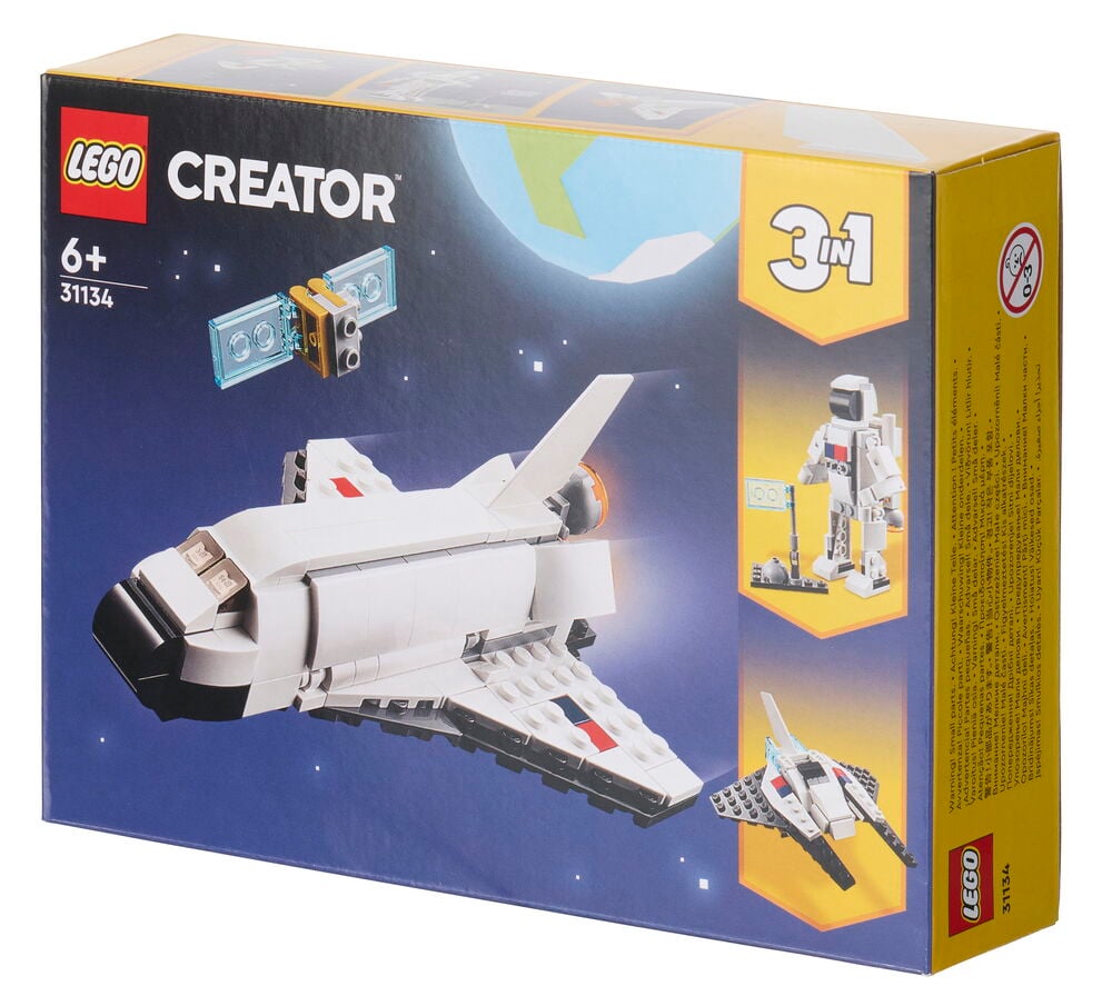 Lego Creator Space Shuttle 144 deler eske viser hvit romferge, astronaut, satellitt og liten romskipmodell.