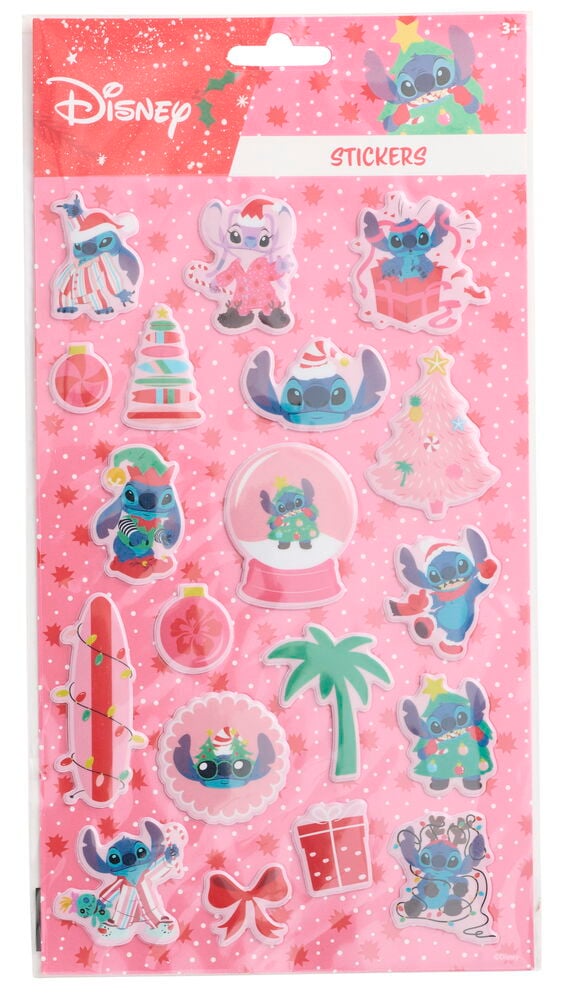 Vaaleanpunainen arkki, jossa on useita erilaisia 3D Disney Stitch joulutarroja, jotka esittävät Stitchiä jouluasuissa ja -elementeissä.
