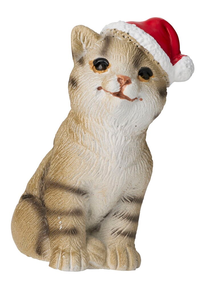En betong dekorationsfigur av en randig julkatt med röd tomteluva.