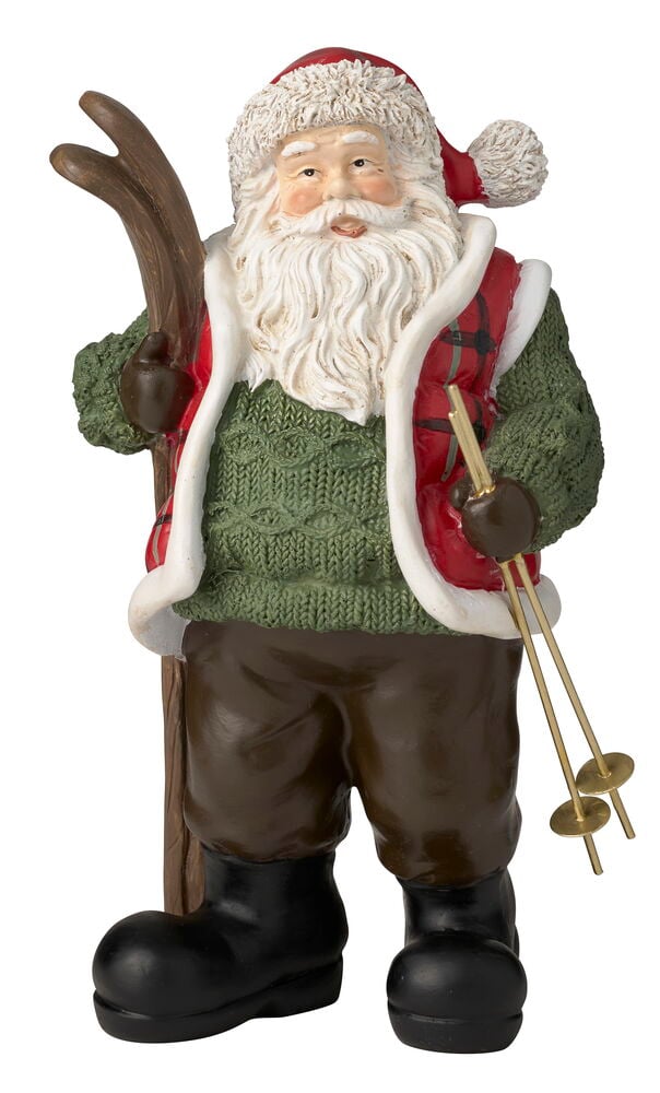Dekoration Weihnachtsmann Grün trägt rote Mütze, grünen Pullover, karierte Weste, braune Hose, schwarze Stiefel, hält Skiausrüstung.