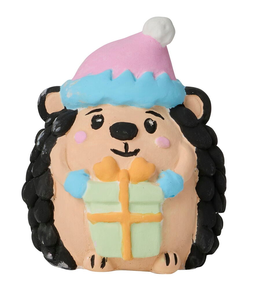 Malerset 6 er-Pack Weihnachten: eine bemalte Igelfigur mit rosa Weihnachtsmütze, hält ein grünes Geschenk.