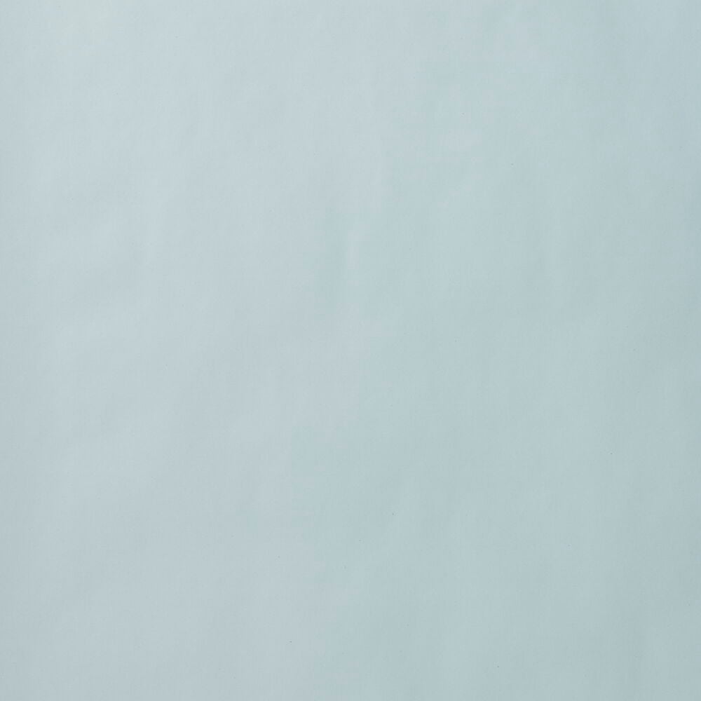 Sileä vihreä lahjapaperipinta.