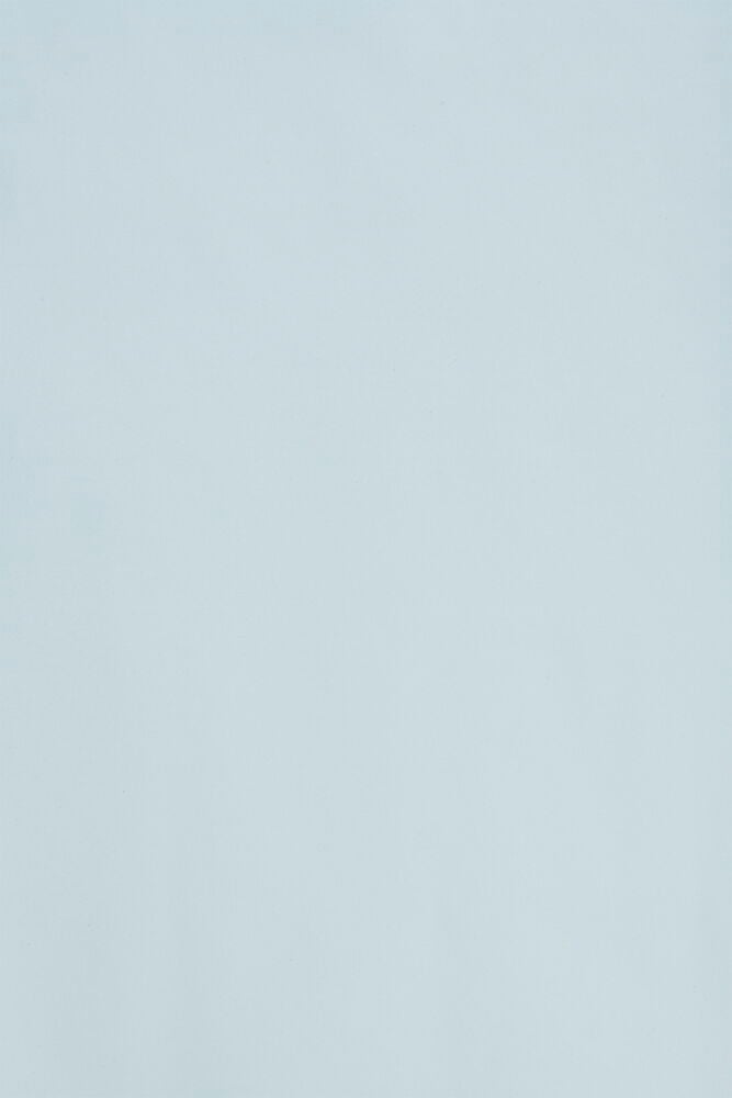 Vihreä lahjapaperi eri väreillä ja kuvioilla.