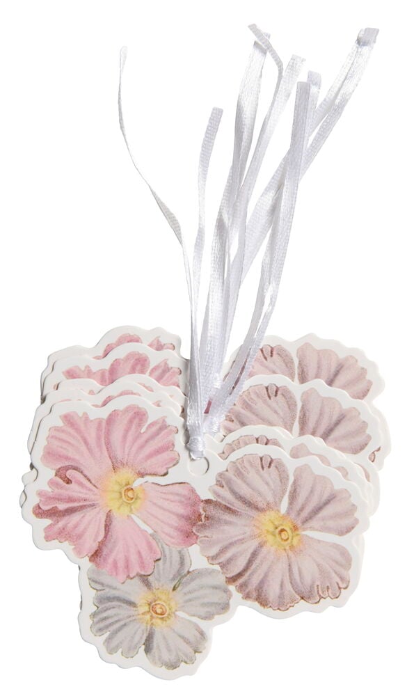 Sekalaisia kukkamuotoisia etikettejä vaaleanpunaisissa ja valkoisissa sävyissä.