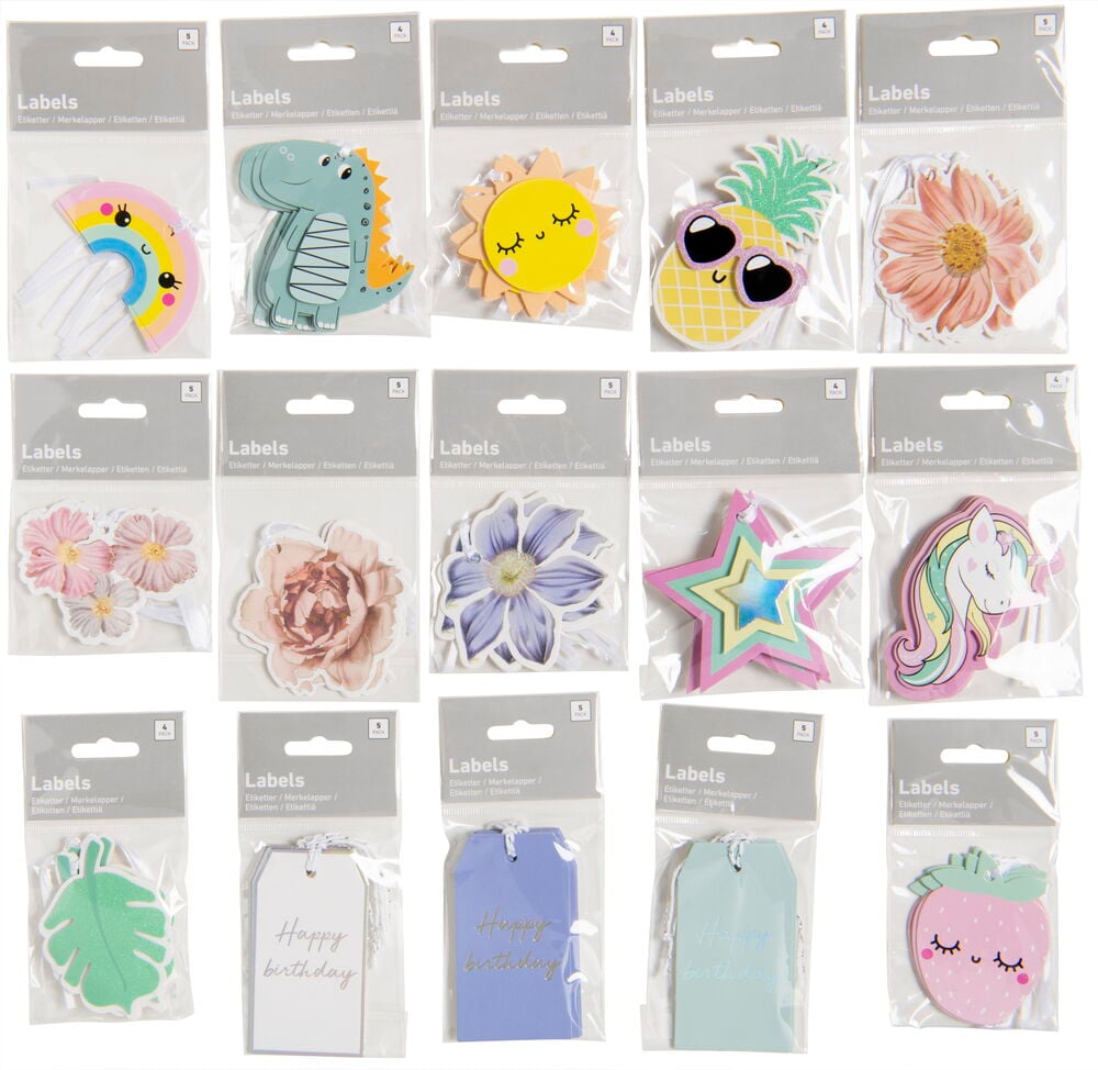 Monipakkaus lahjatunnisteita, joissa on erilaisia kuvioita ja värejä.