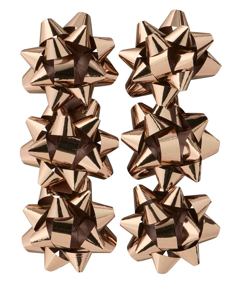 Acht metallische Roségold Geschenkrosette Mixed, in zwei Spalten angeordnet.