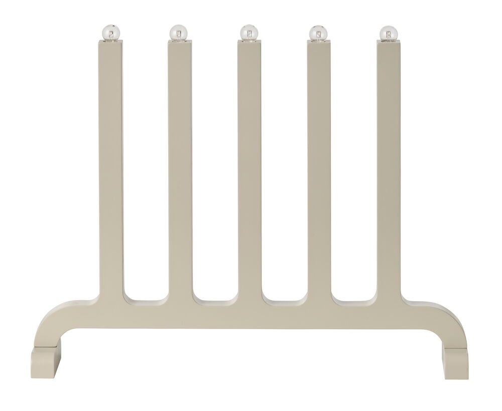 Beige dekorativt ställ med fem vertikala pelare och klara sfäriska toppar på en horisontell bas.