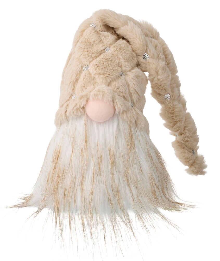 Weihnachtswichtel Theo 20 cm hat eine beige Kunstfellmütze mit Pailletten, eine rosa Nase und einen weißen und braunen Kunstfellbart.