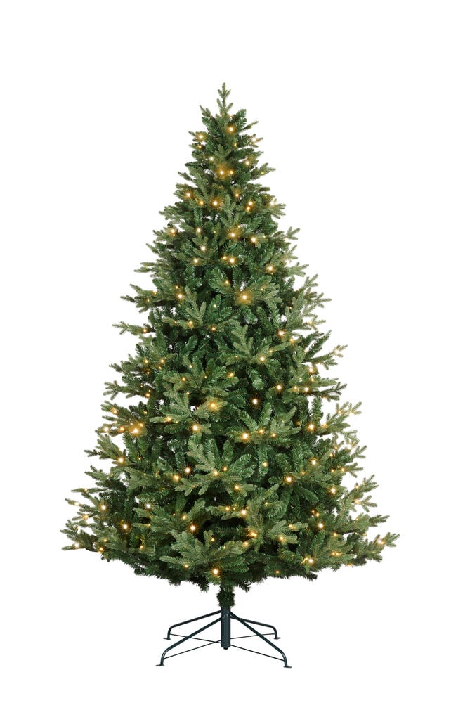Et grønt Juletre Chamonix PVC/PE 456 LED, forhåndsbelyst med varmhvite lys, på et mørkt metallstativ.