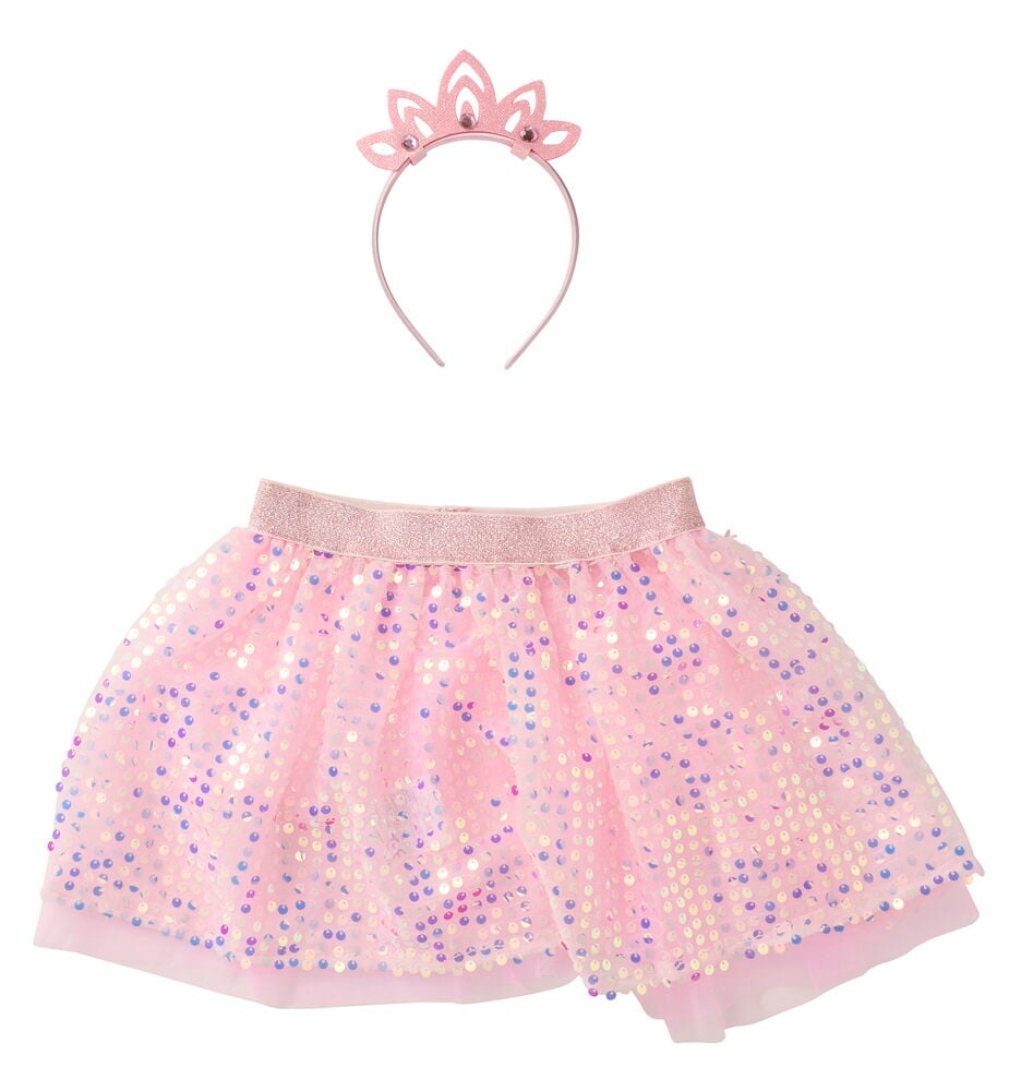 Verkleidungsset, Kinder mit einem rosa Paillettenrock und passendem rosa Diadem mit Strass.