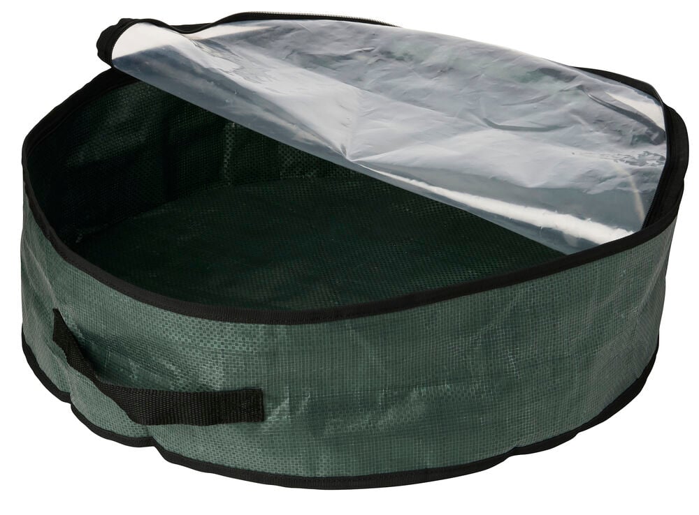 Grüne Aufbewahrungslösung für Kränze Ø53 cm mit teiloffenem klarem Reißverschlussdeckel und schwarzem Griff.