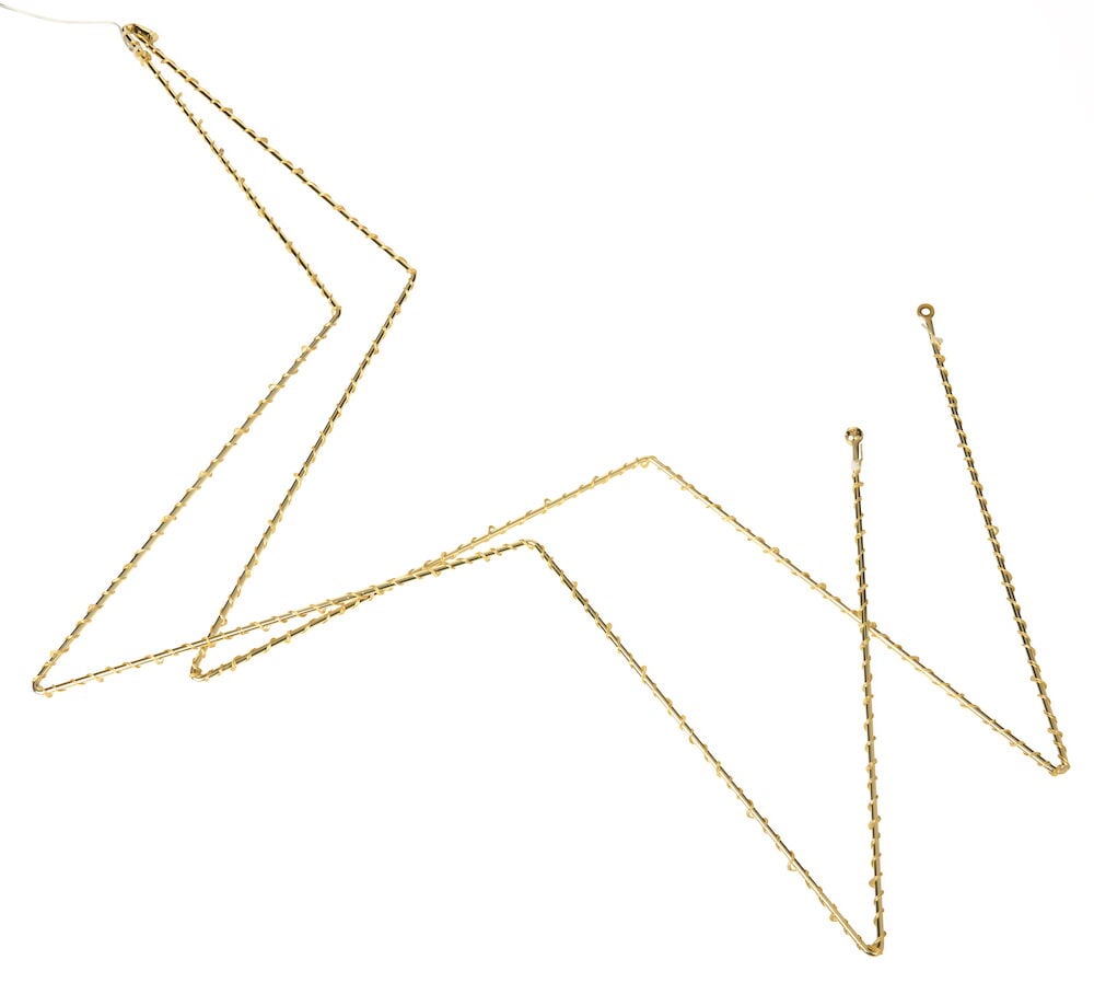 Stjärnformad dekorationsbelysning i guldfärgad metall.