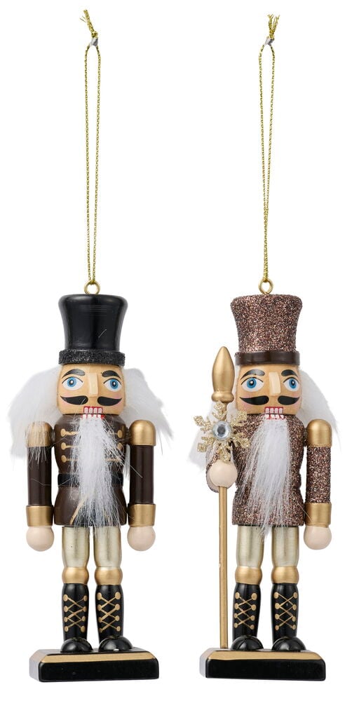 Zwei Nussknacker-Ornamente: einer braun mit schwarzem Hut, der andere glitzernd bronze mit goldenem Speer.