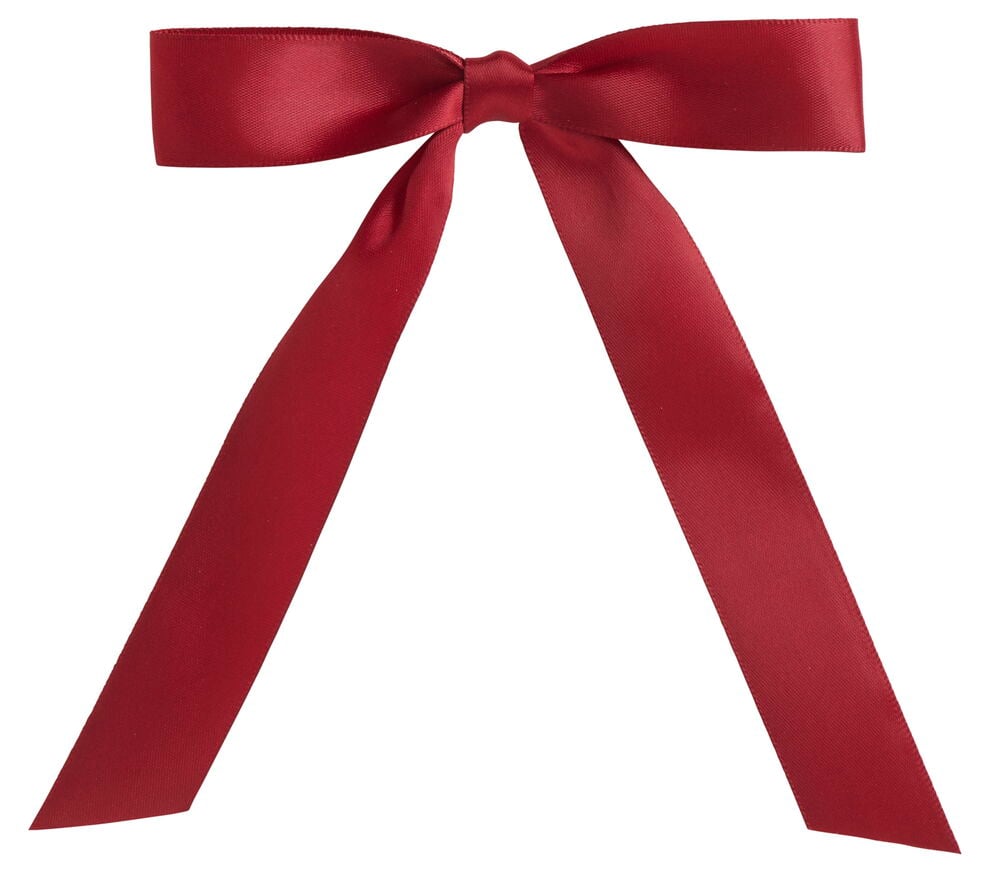 En röd julgransrosett i satin med två öglor och två långa hängande band.