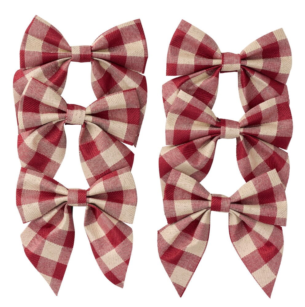 Eine Rosette 6 er-Pack mit sechs rot-beigen karierten Textilschleifen.
