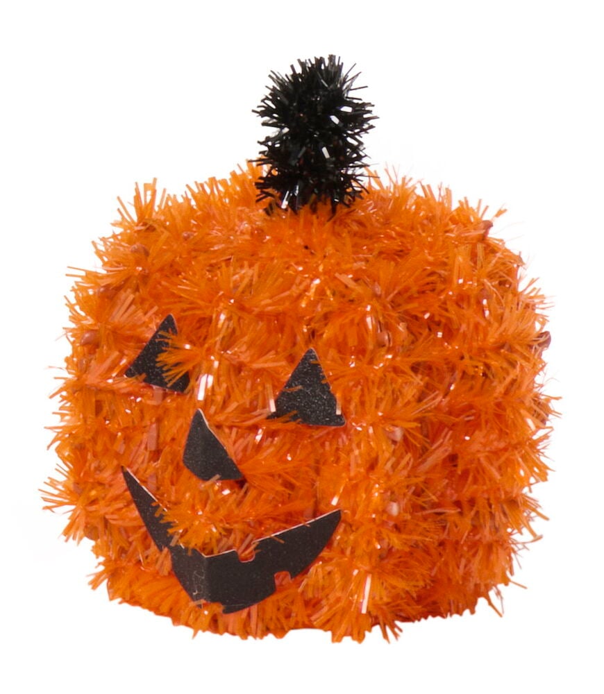 Orange glitterfigur Halloween dekoration med svart stjälk och jack-o'-lantern ansikte.