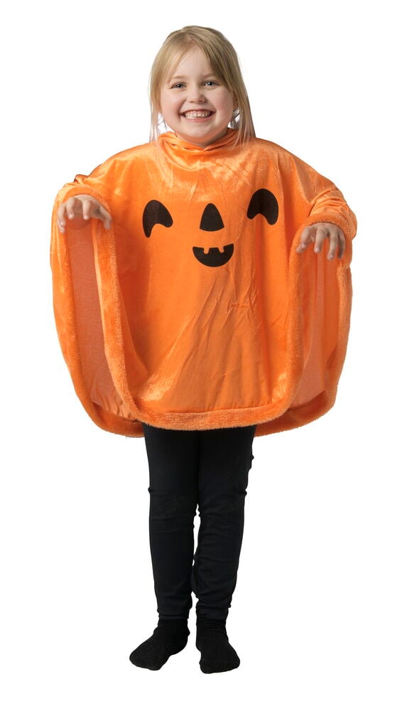 Orange plysch Poncho, barn Halloween One size med pumpaansikte, över svarta leggings och strumpor.