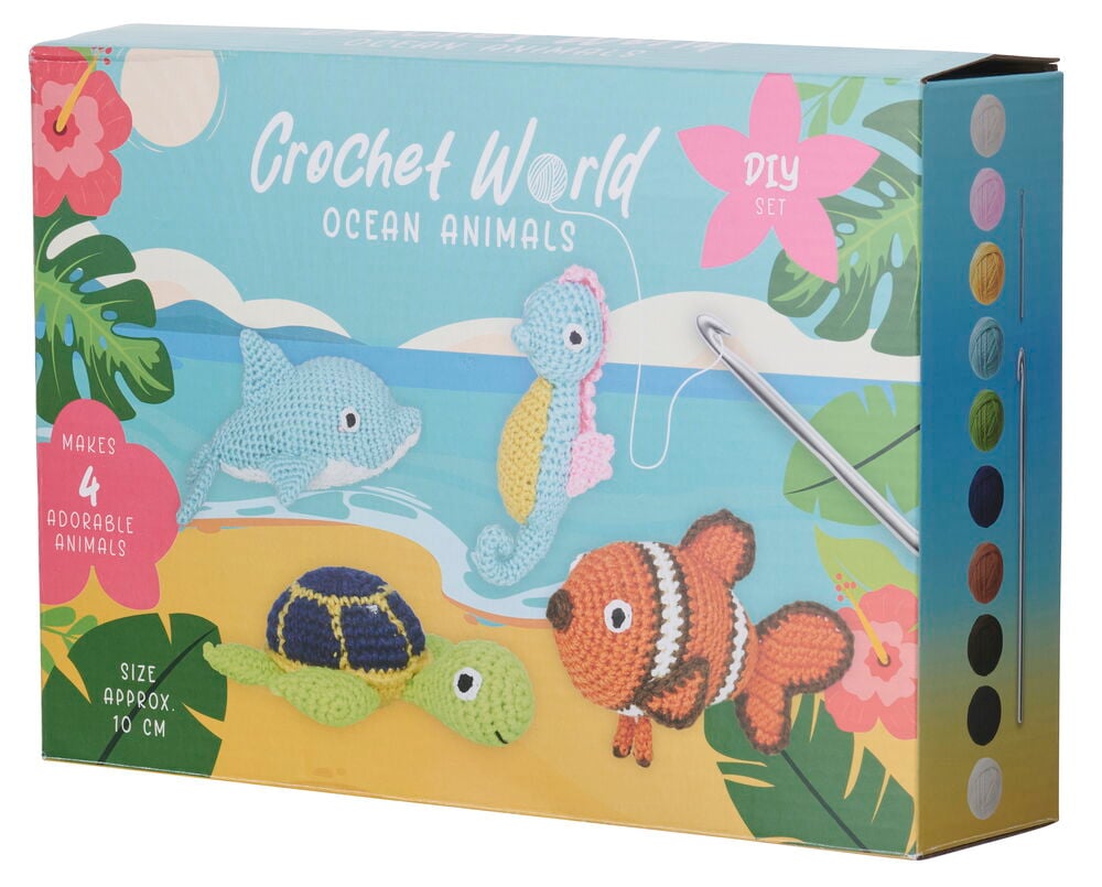 Häkel-Set 4 er-Pack Ocean Animals-Box zeigt fertige Haie, Seepferdchen, Schildkröte, Clownfisch und Garn.