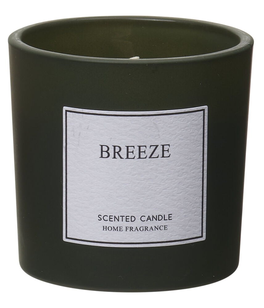 Grüne Duftkerze in stilvoller Glasbehälter.