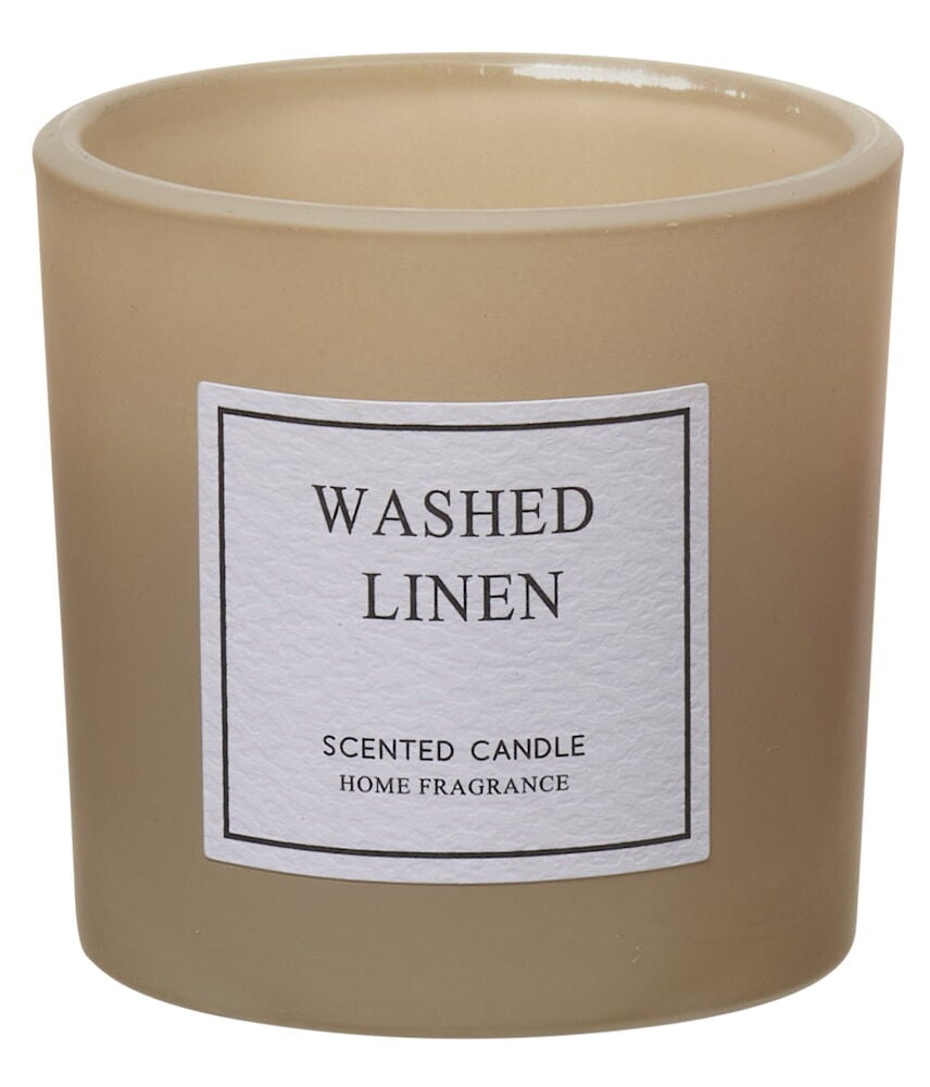 Beiges Duftkerze im Glas mit Etikett.