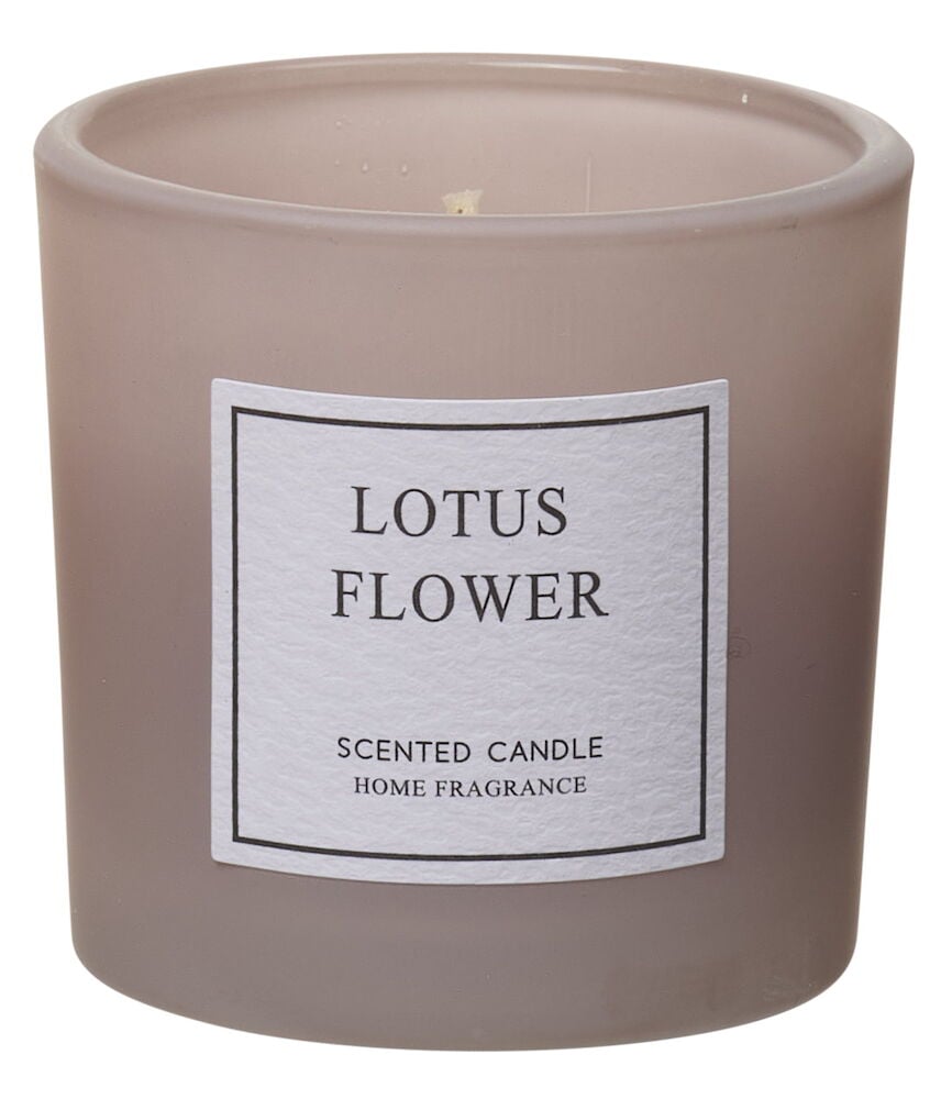 Hellrosa Duftkerze im Glas mit Lotusblütenduft.