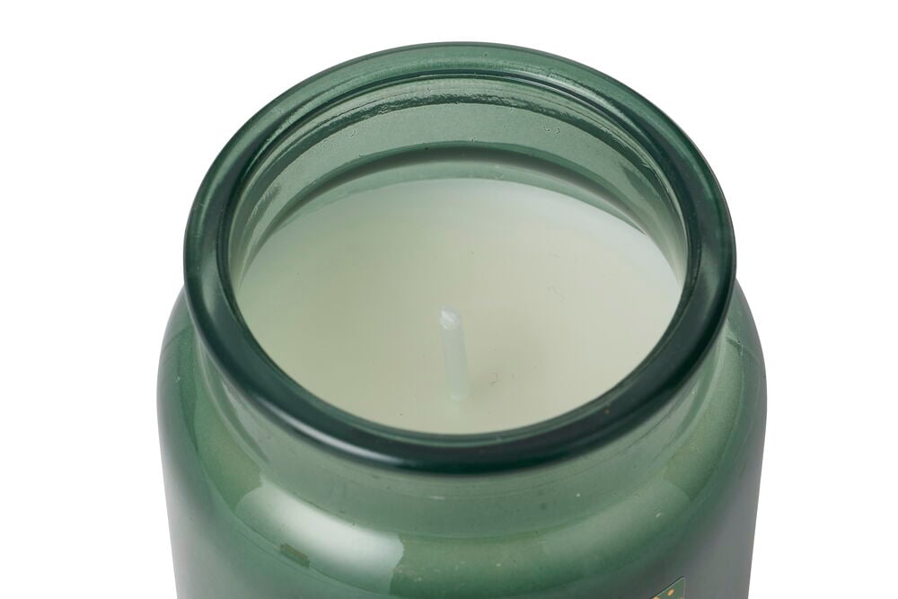 Nærbilde ovenfra av et Duftlys Nature Grønn Glass med hvit voks og synlig veke.