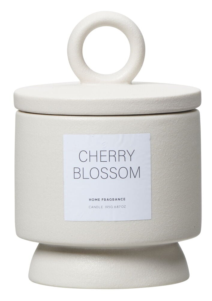 Beige doftljus i keramikkruka med lock.