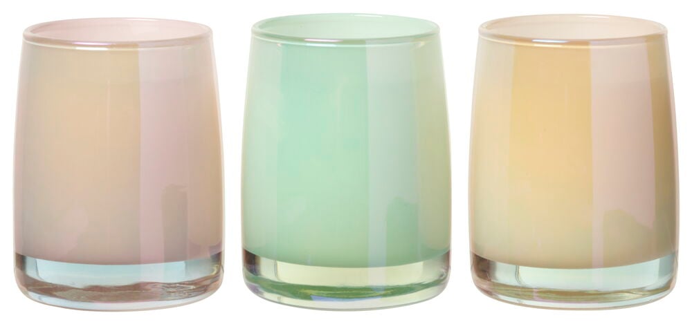 Tre duftlys i glassholdere, blandede pastellfarger.