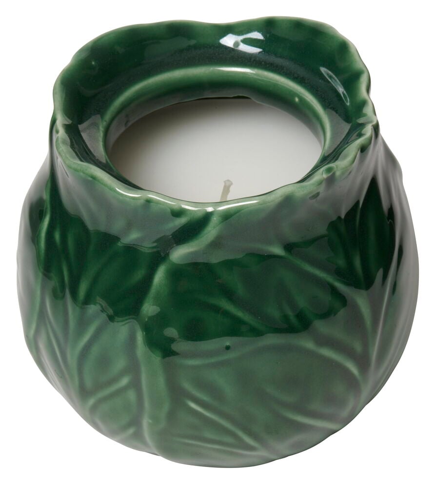 Grønt duftlys i keramikkbeholder med bladstruktur.