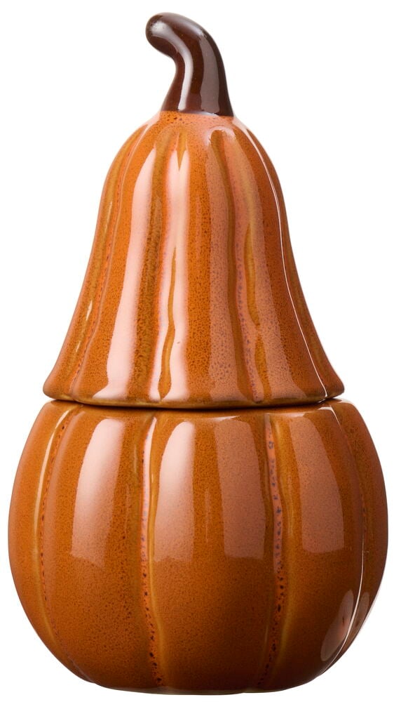 Ett blankt orange keramiskt doftljus format som en pumpa med mörkbrun stjälk och räfflade detaljer.