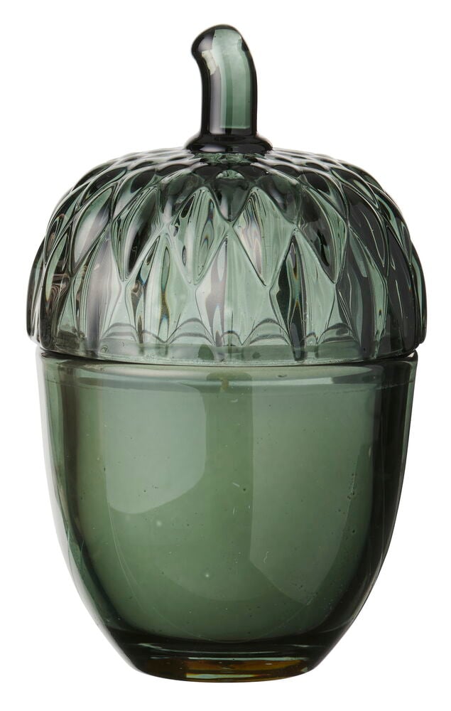 Vihreä lasinen tuoksukynttilä, muotoiltu tammenterhoksi, jossa on kuvioitu kansi ja sileä alaosa.