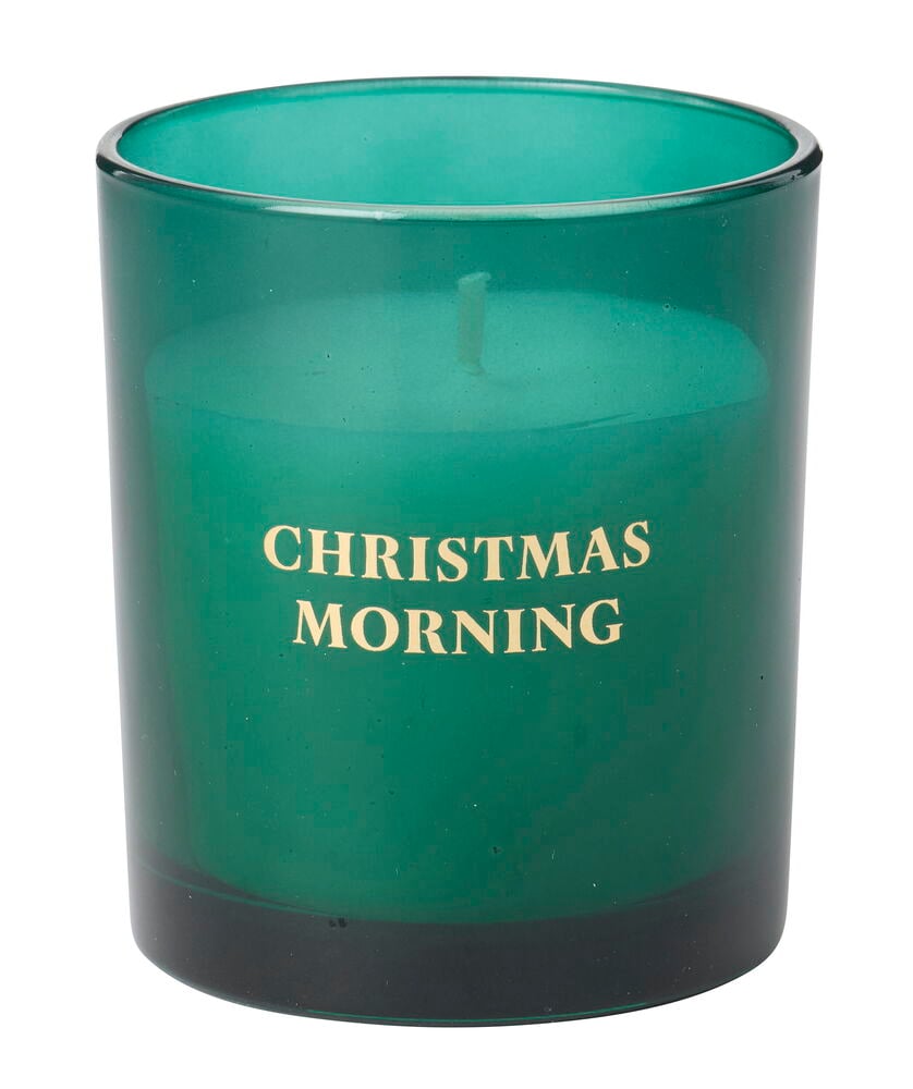 Ett grönt Doftljus Merry i en genomskinlig grön glasbehållare med texten "CHRISTMAS MORNING" i guld.