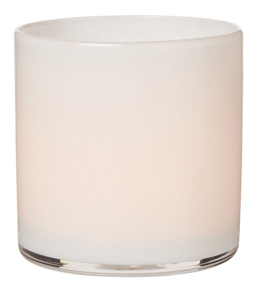 Vit cylindrisk värmeljushållare i glas.