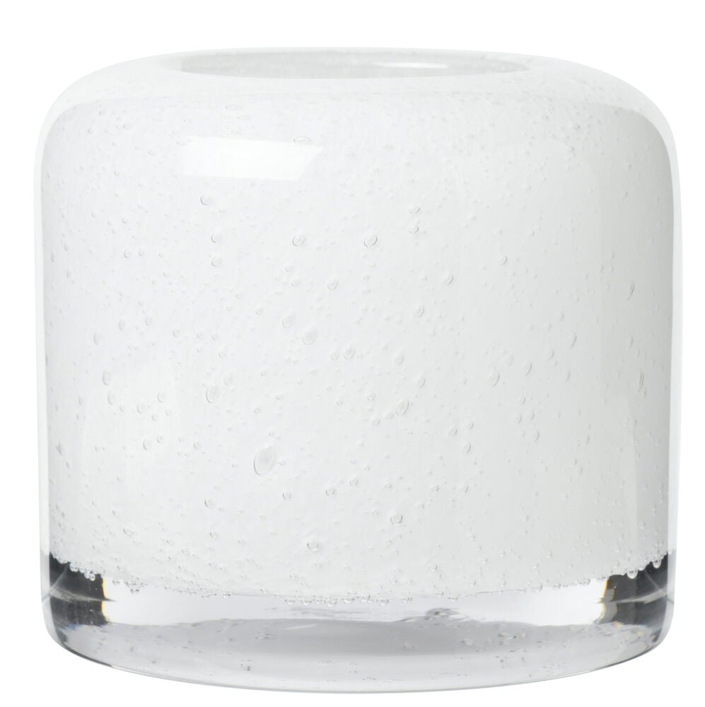 Runder weißer Teelichthalter aus Glas mit Blasen.