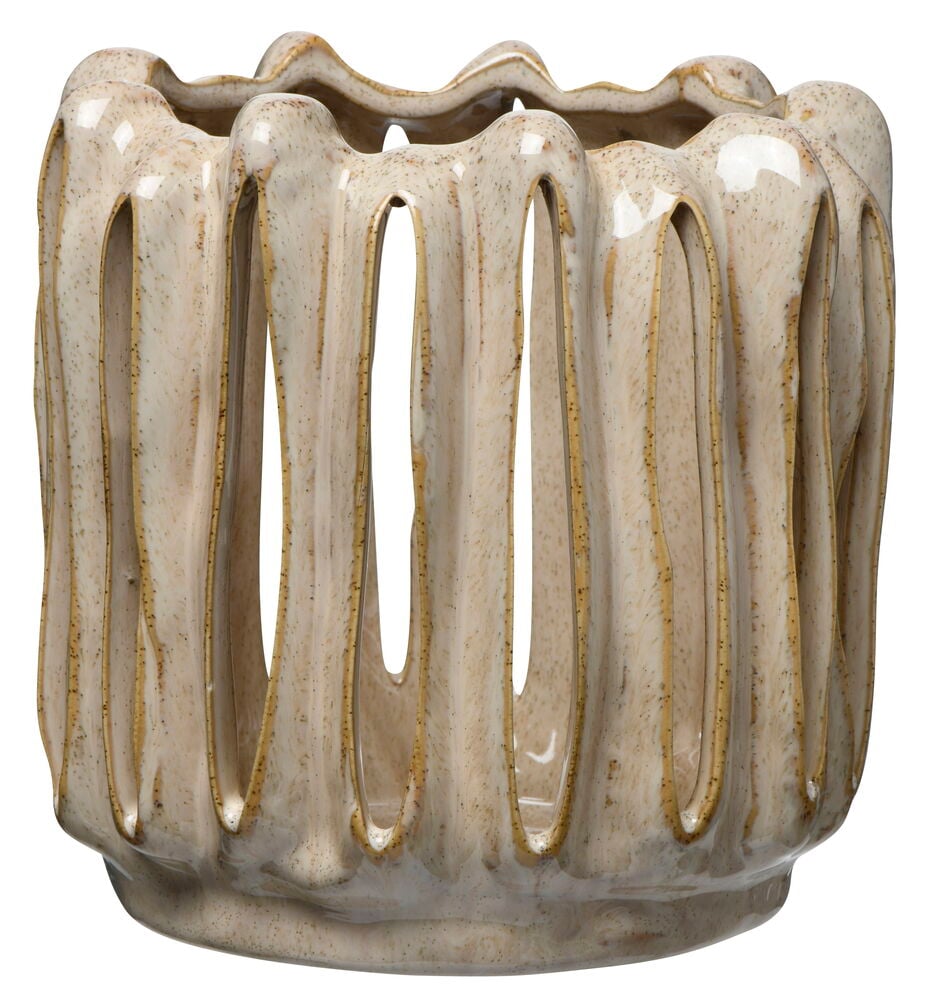 Beige lyhty kivitavarasta, jossa on orgaanisesti muotoillut aukot.