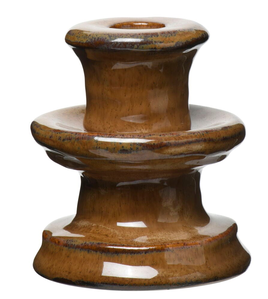 Brauner organischer Kerzenhalter aus glasiertem Steingut.