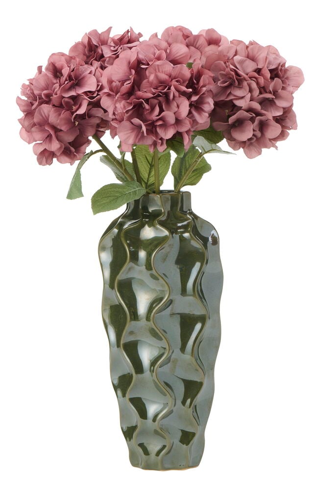 Mörkrosa hortensior i en mörkgrön, vågformad vas.