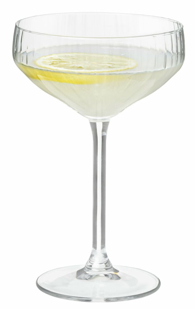 Champagneglas med mjuka linjer och citronskiva.