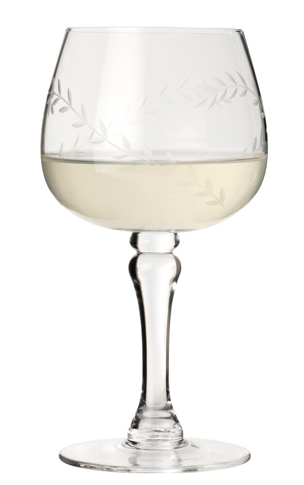 Et klart vinglass Thea, fra en 2-pk, med etset bladmotiv, fylt med lys gul væske.
