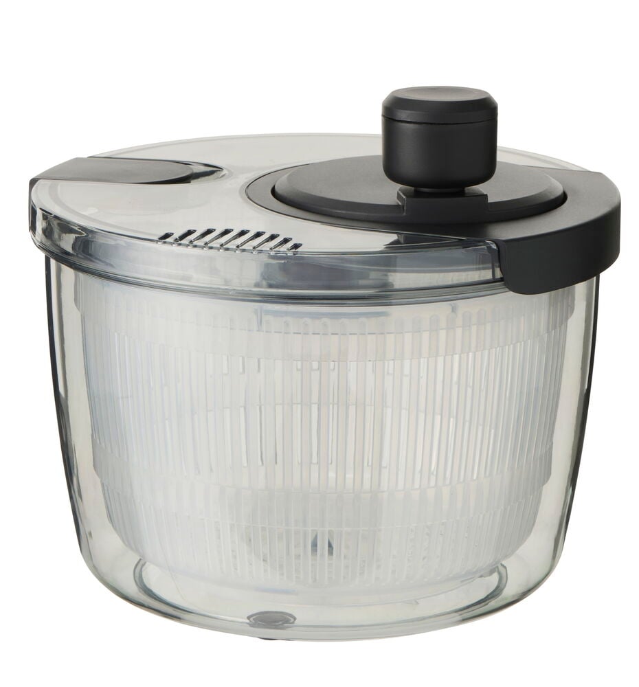 Transparent salladsslunga med svart lock och pumpknapp.