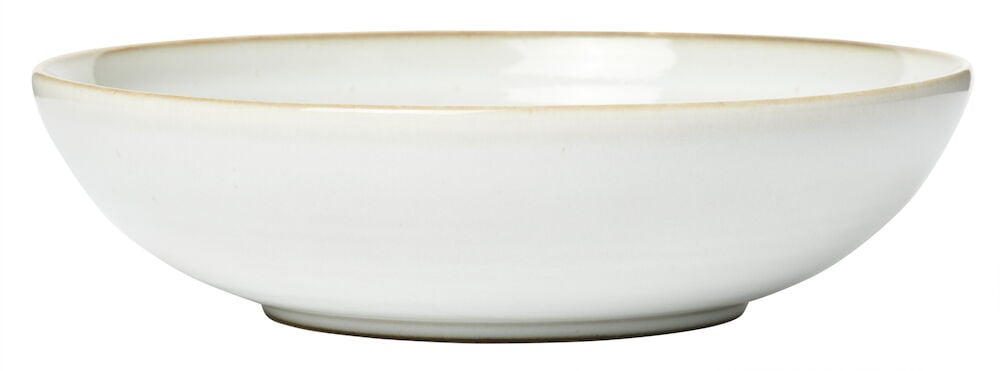 Syvä valkoinen kivitavaralautanen, pyöreä muoto.