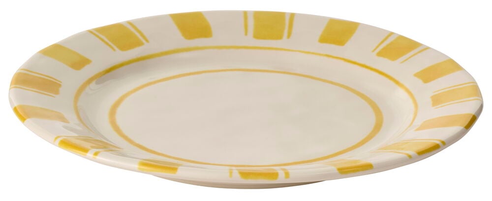 Keltainen leipälautanen, jonka reunalla on koristeellisia raitoja.