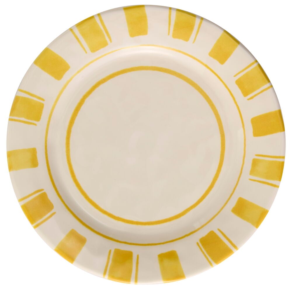 Keltainen lautanen koristeellisella kuviolla reunan ympärillä.